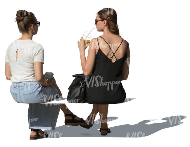 two cut out women sitting and drinking smoothies