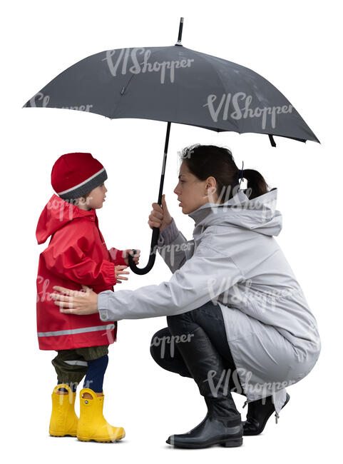 cut out mother squatting and talking to her little son in the rain