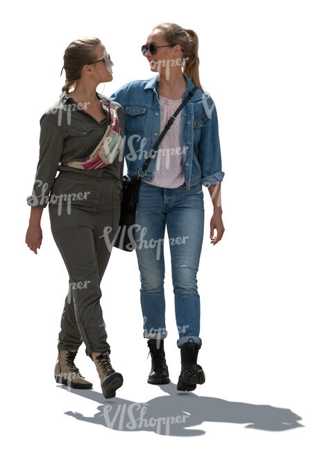 two cut out backlit women walking arm in arm 