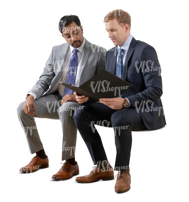 two cut out businessmen sitting and reading some papers