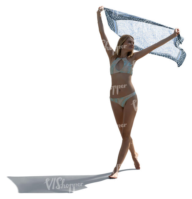 cut out backlit woman in a bikini holding a light towel up in the air