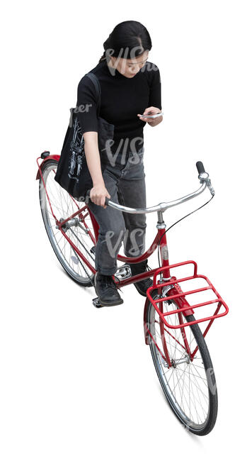 woman with bicycle standing and checking her phone seen from above
