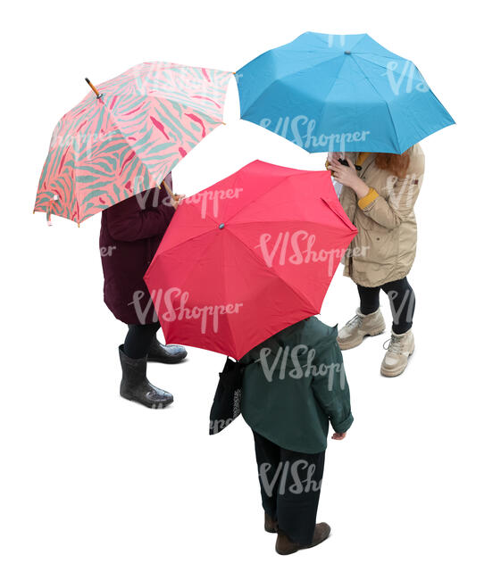 three cut out women with umbrellas standing seen from above