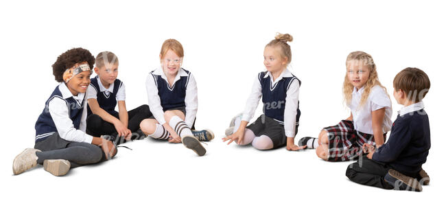 six cut out schoolchildren sitting on the ground in a circle