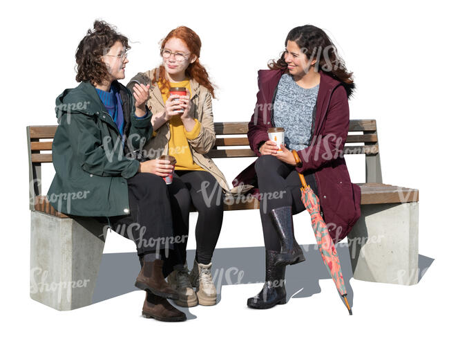 three cut out women sitting and talking in autumn