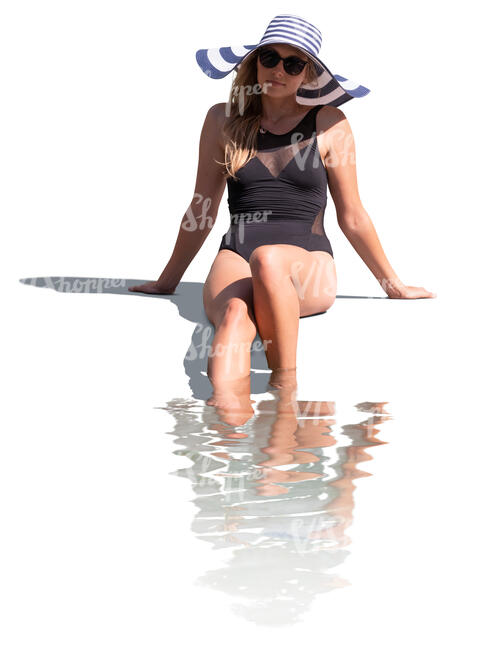 cut out woman sitting at the edge of the pool with her legs in the water