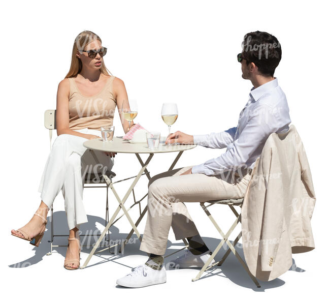 cut out man and woman sitting in a street cafe and drinking wine