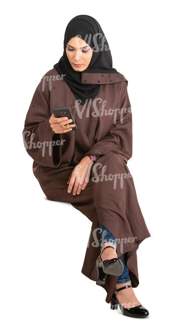 cut out muslim woman in a brown abaya sitting