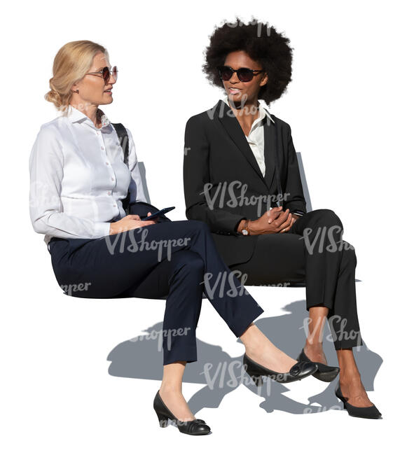 two businesswomen sitting and talking