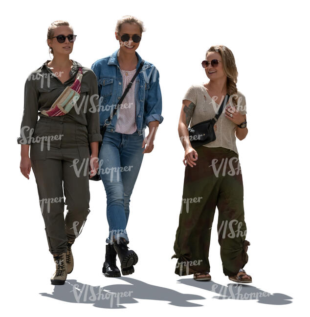 three cut out backlit women walking and talking cheerfully