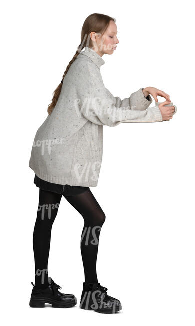 cut out woman standing at a counter and drinking coffee