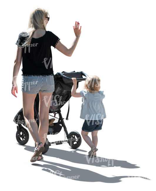 backlit image of a mother and daughter walking