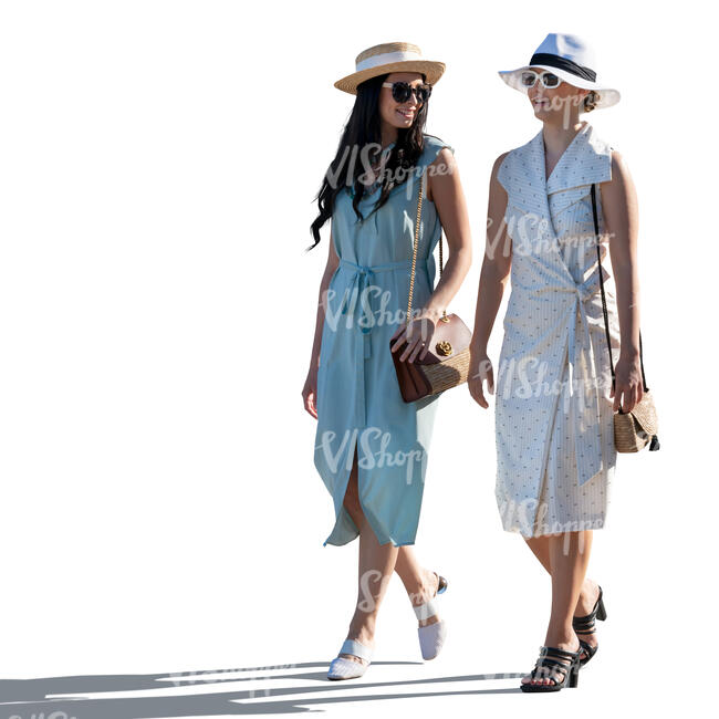 two backlit women walking and talking