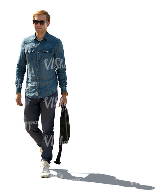 cut out sidelit image of a young man walking