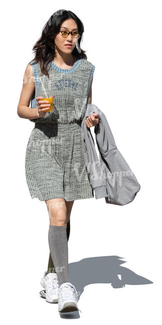 cut out chinese woman drinking a soft drink walking on the street