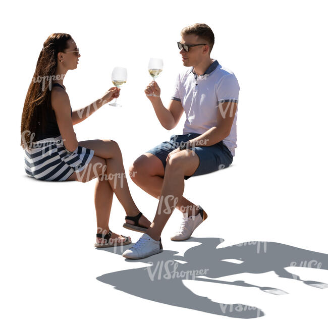 cut out backlit man and woman sitting in a cafe and drinking wine
