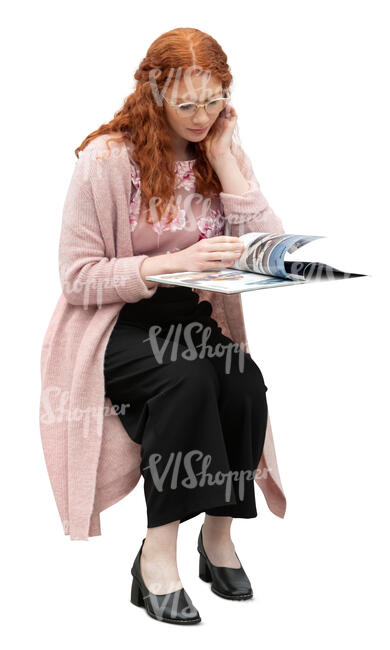 cut out woman sitting at a table and reading a magazine