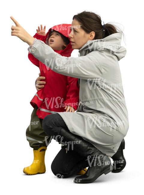 cut out woman with small child squatting and pointing at smth