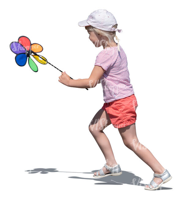 cut out little girl with a colorful toy playing