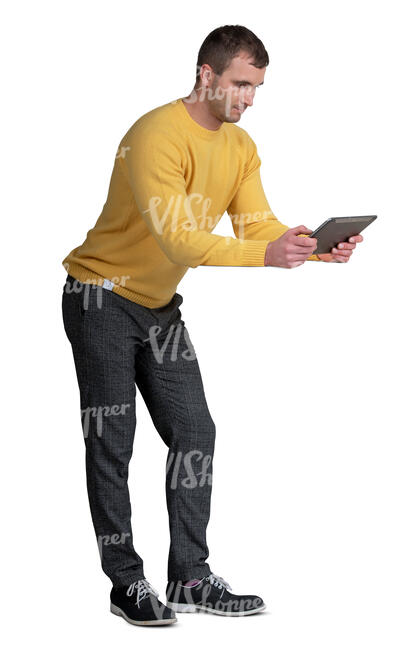 cut out man leaning on a table and looking at a tablet