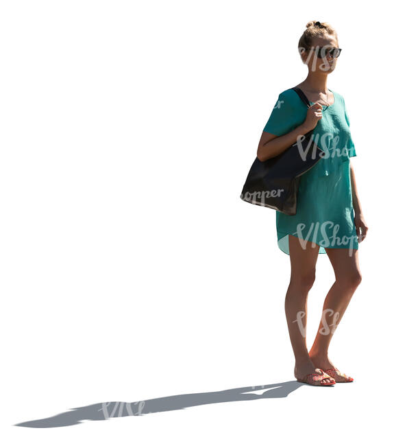 cut out backlit woman in a green summer dress standing