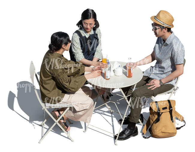 three cut out young people sitting in a cafe seen from above