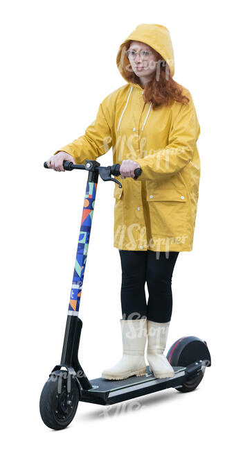 cut out woman in a yellow raincoat riding a scooter