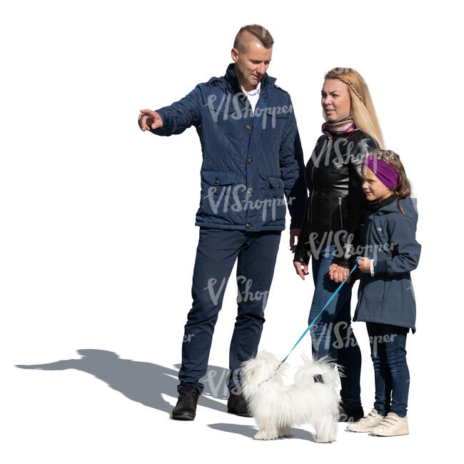 cut out family with a dog standing on a sunny autumn day