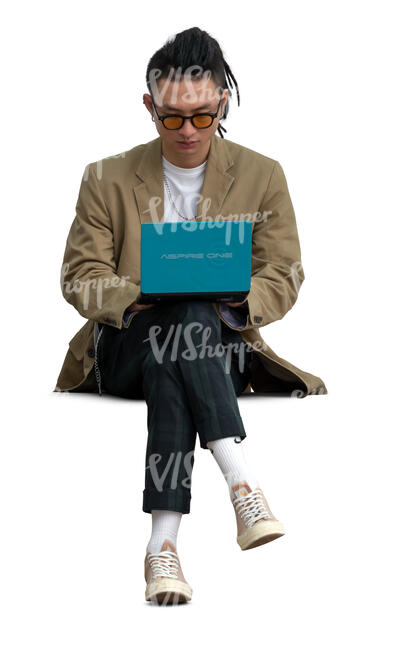 cut out young asian man sitting and working with a tablet