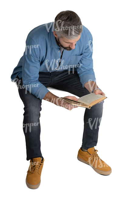 cut out man sitting and reading seen from above