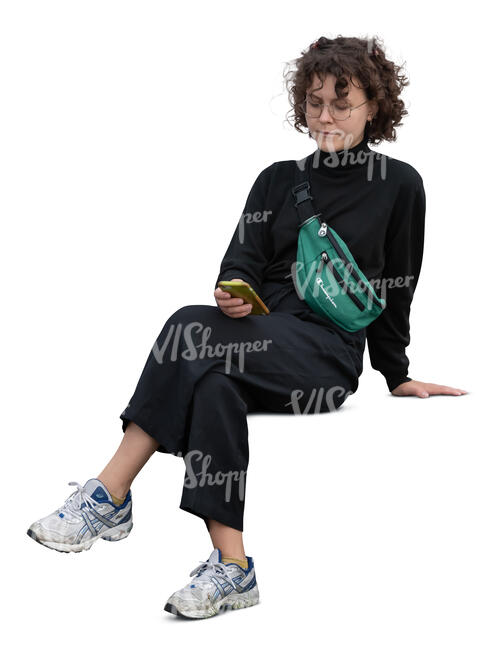 cut out young woman with a phone in her hand sitting