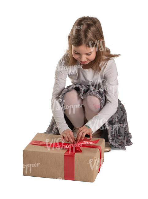 cut out little girl squatting and unwrapping a present