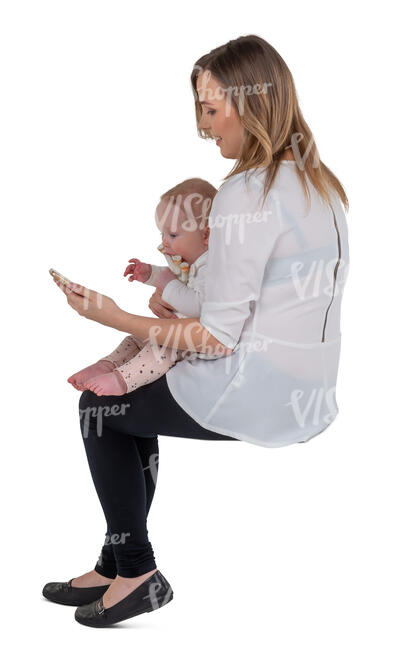 cut out woman holding a baby sitting and making a phone call