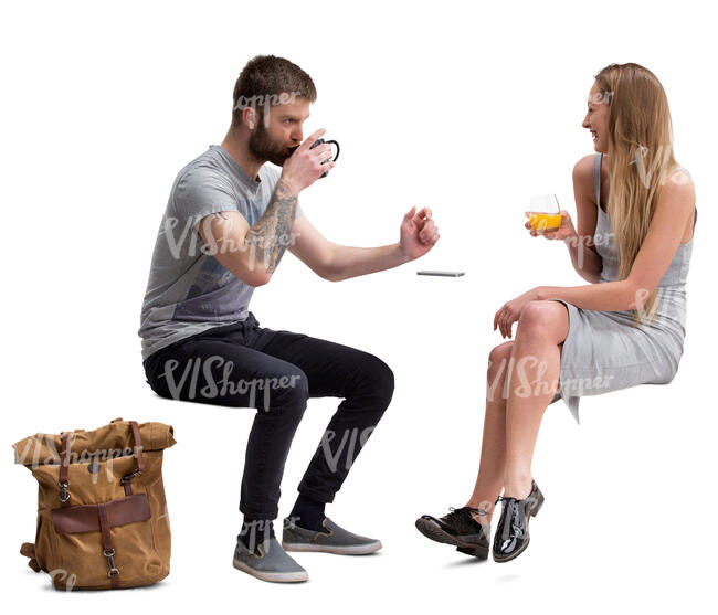 man and woman sitting in a cafe and talking