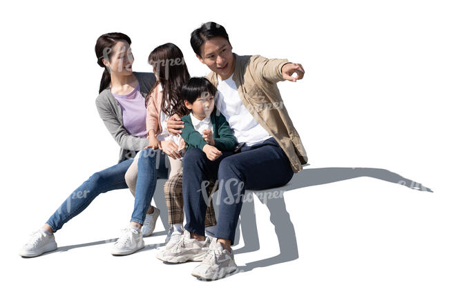 cut out chinese family with two kids sitting and looking at smth