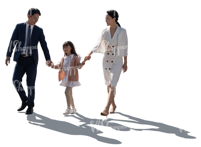 cut out backlit image of an asian family walking