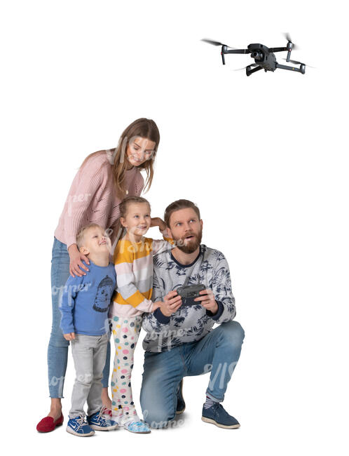 cut out family flying a drone