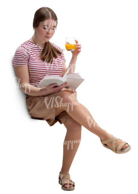 young woman sitting in a cafe and reading