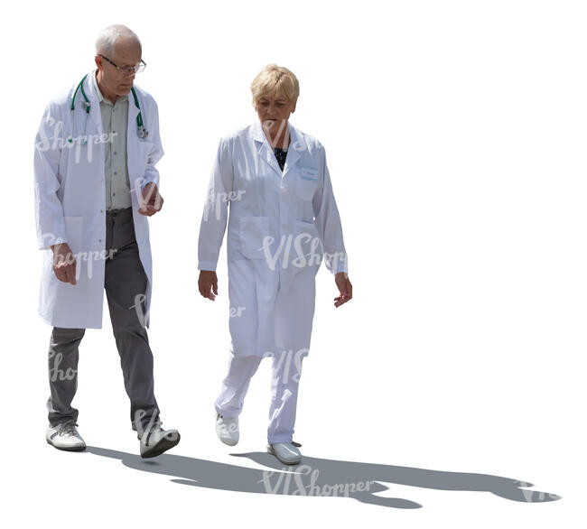 two cut out backlit doctors walking