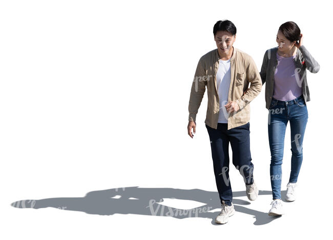 cut out asian couple walking arm in arm seen from above