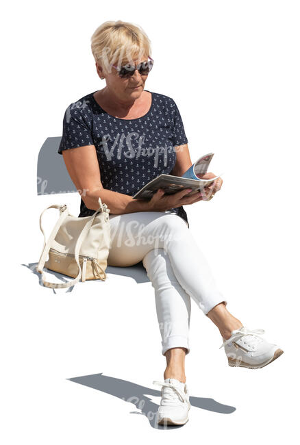 cut out older woman sitting and reading a magazine