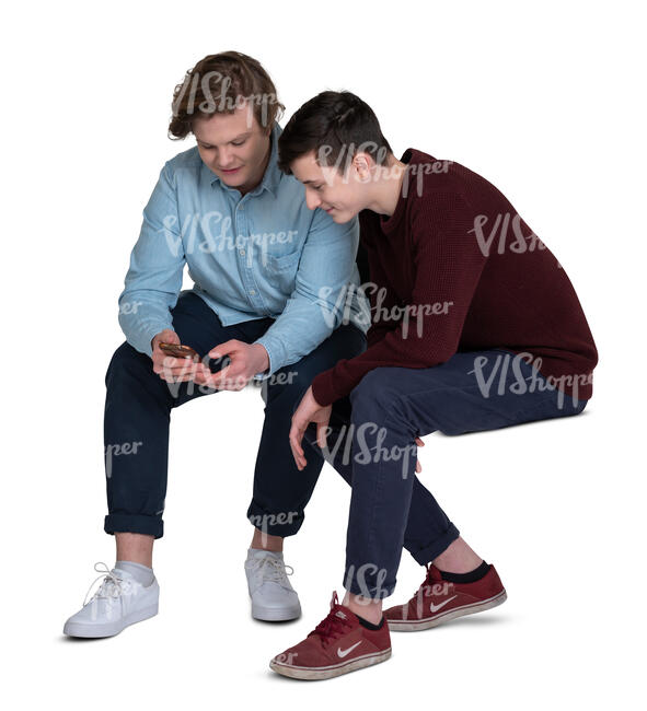 two cut out teenage boys sitting