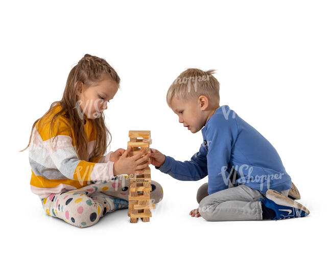 two cut out kids playing on the floor with some wooden toys