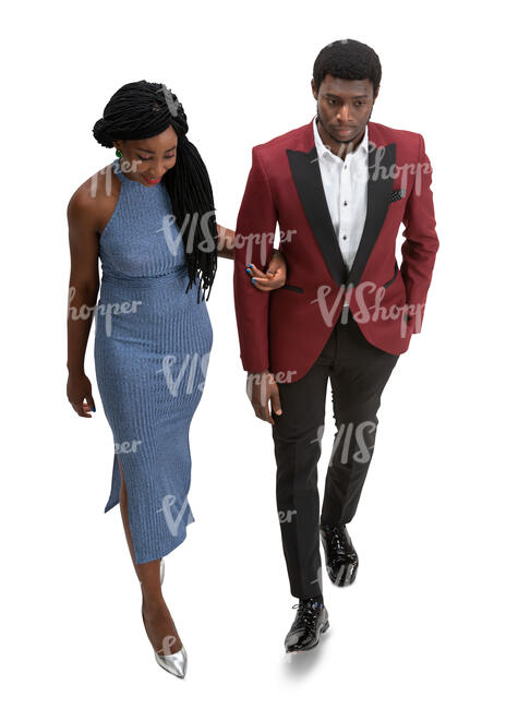 cut out black couple walking arm in arm at a forma event seen from above