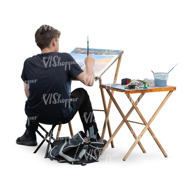 cut out young man sitting and painting