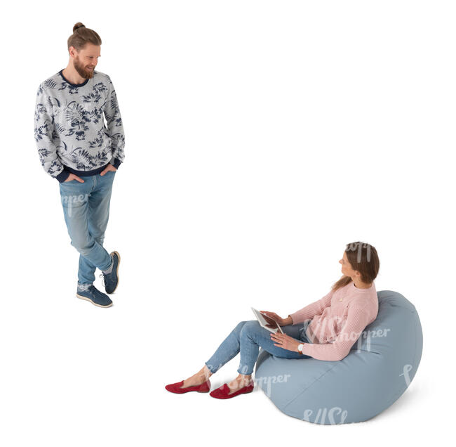 cut out woman sitting in a bean bag talking to a man standing by