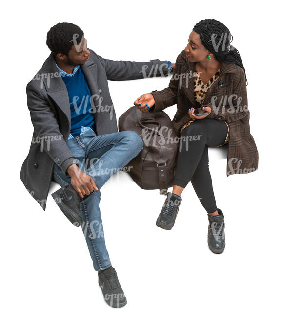 cut out black man and woman sitting and talking seen from above