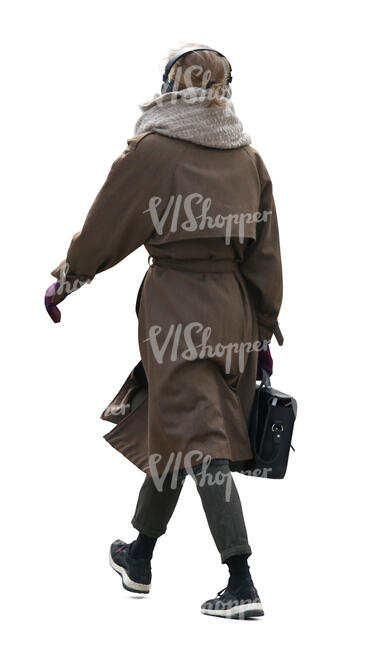 cut out woman in a brown overcoat walking