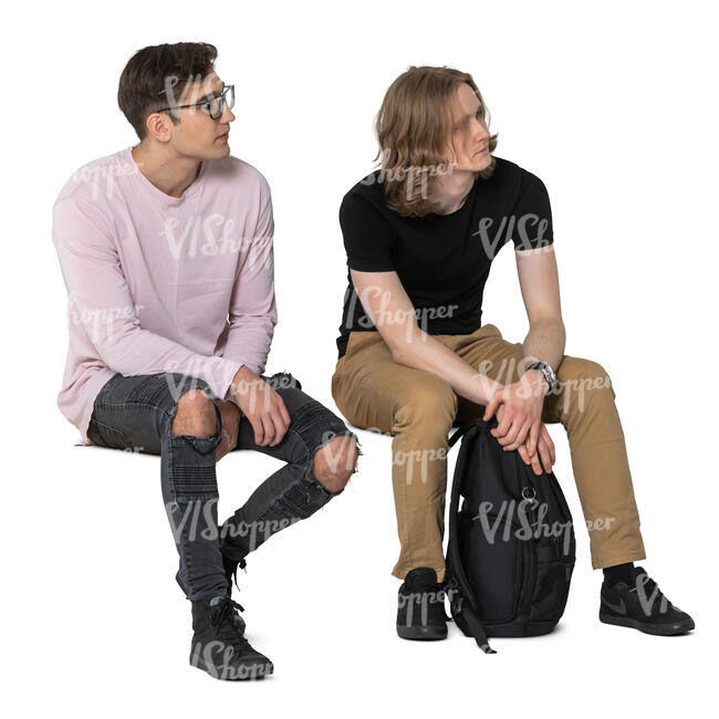 two cut out young men sitting