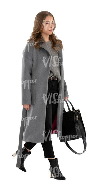 cut out woman in a grey overcoat walking